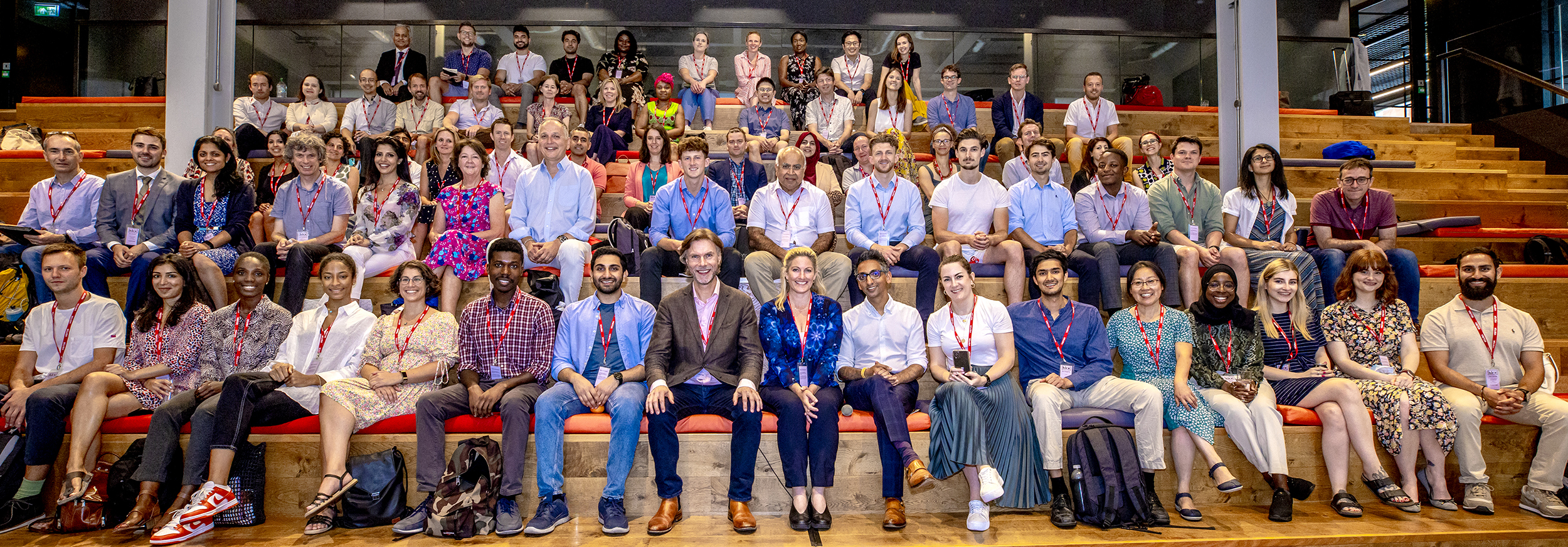 Group of people sitting and smiling at the camera